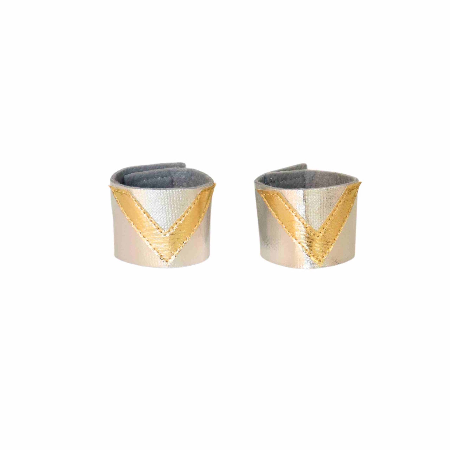 a pair of silver and gold cuff earrings