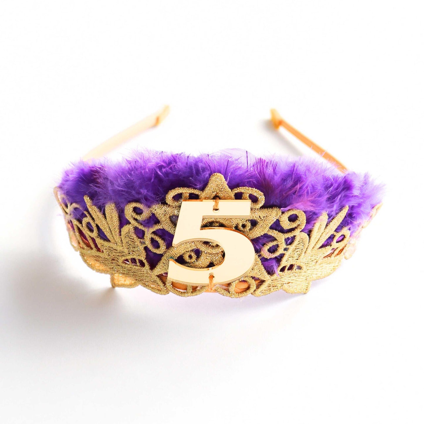 a purple and gold crown with the number five on it
