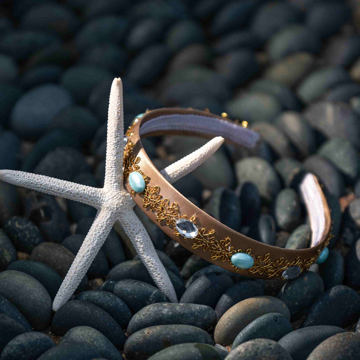 a starfish laying on top of a pile of rocks