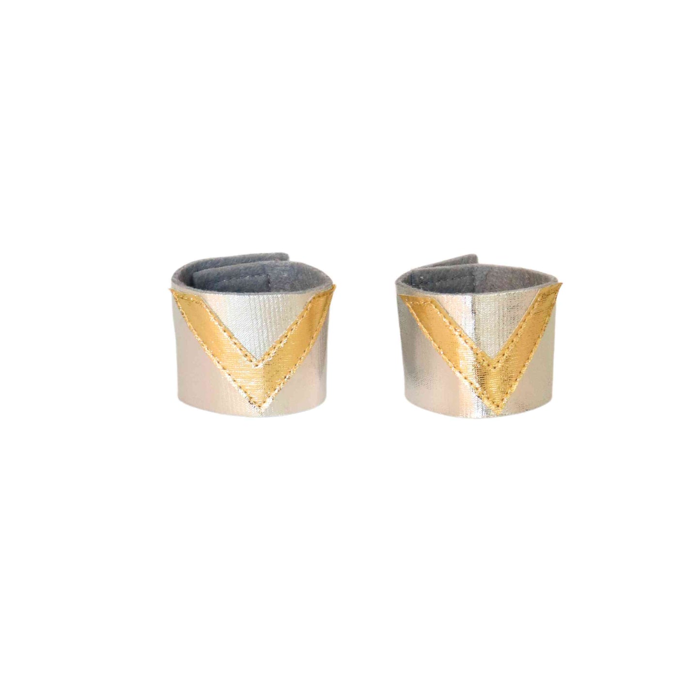 a pair of silver and gold cuff earrings