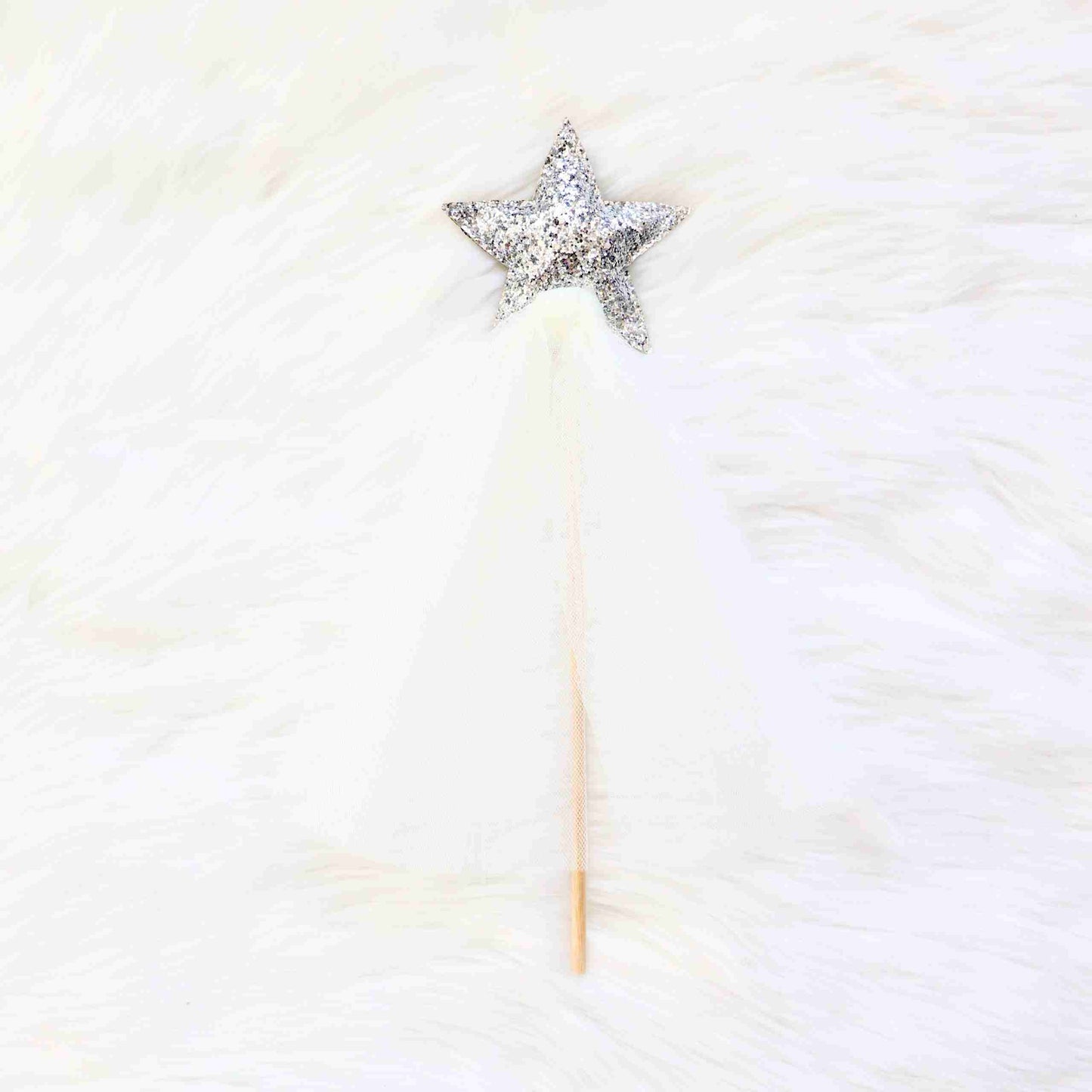 a star shaped object on top of a white fur