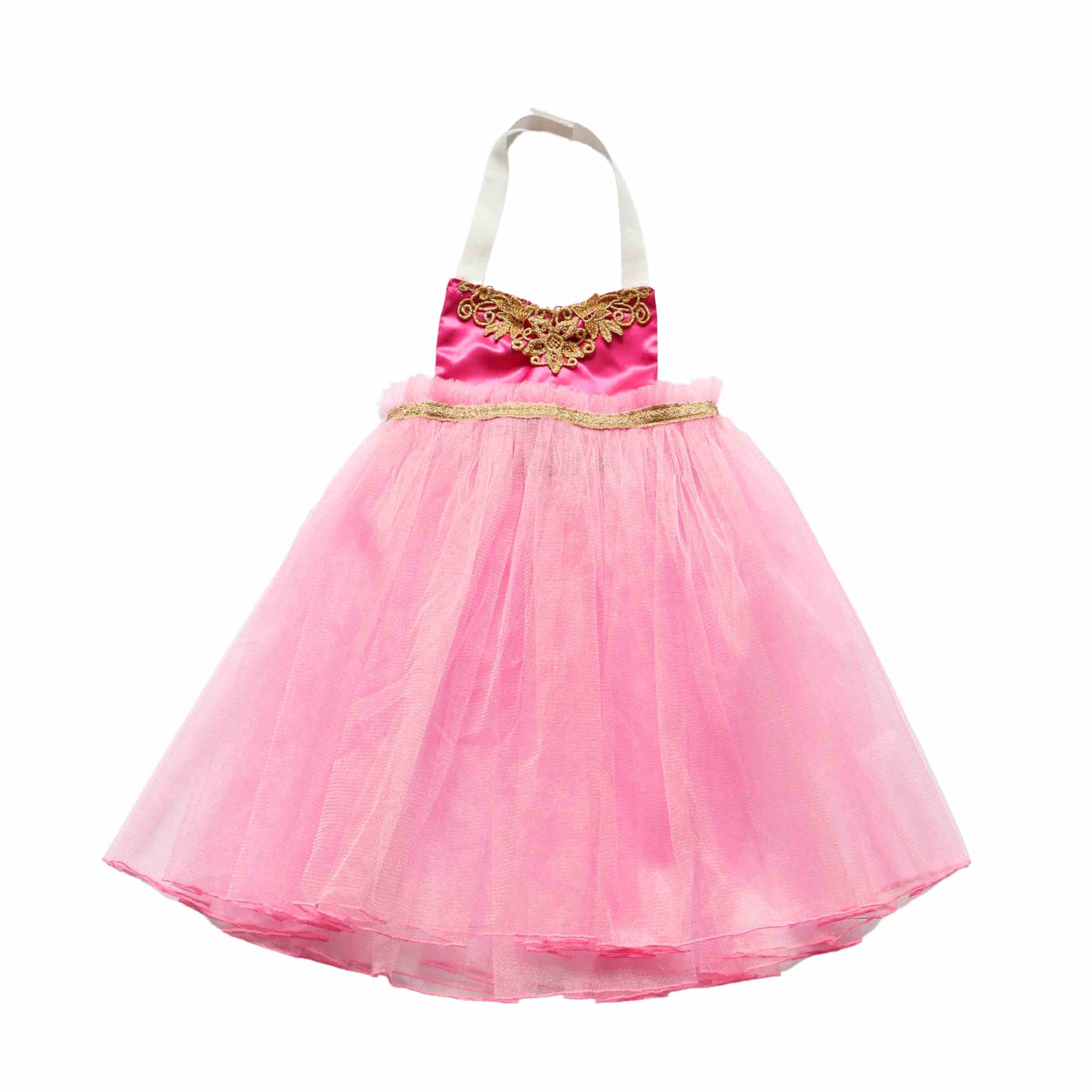 a little girl wearing a pink dress with a gold bow