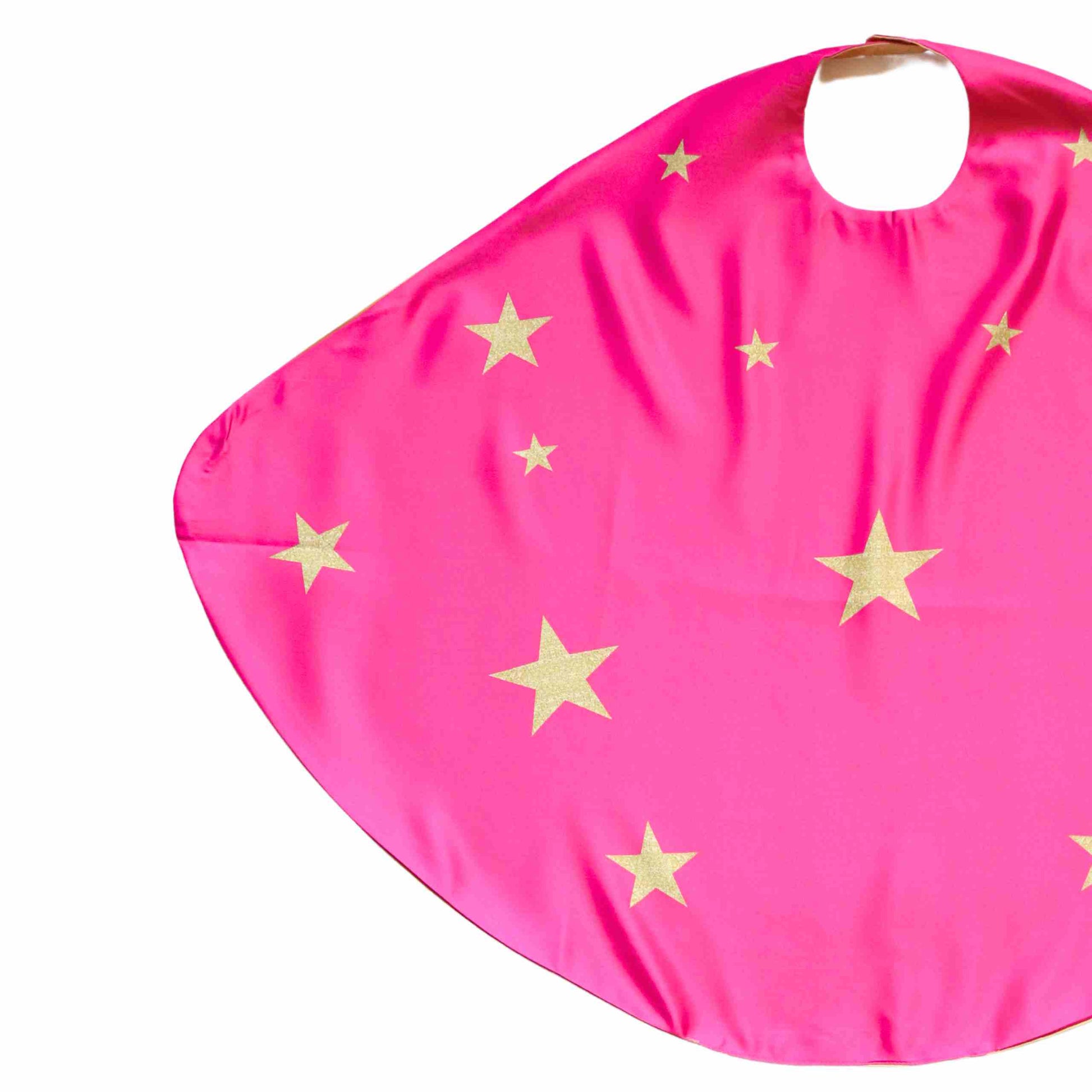 a pink bib with gold stars on it