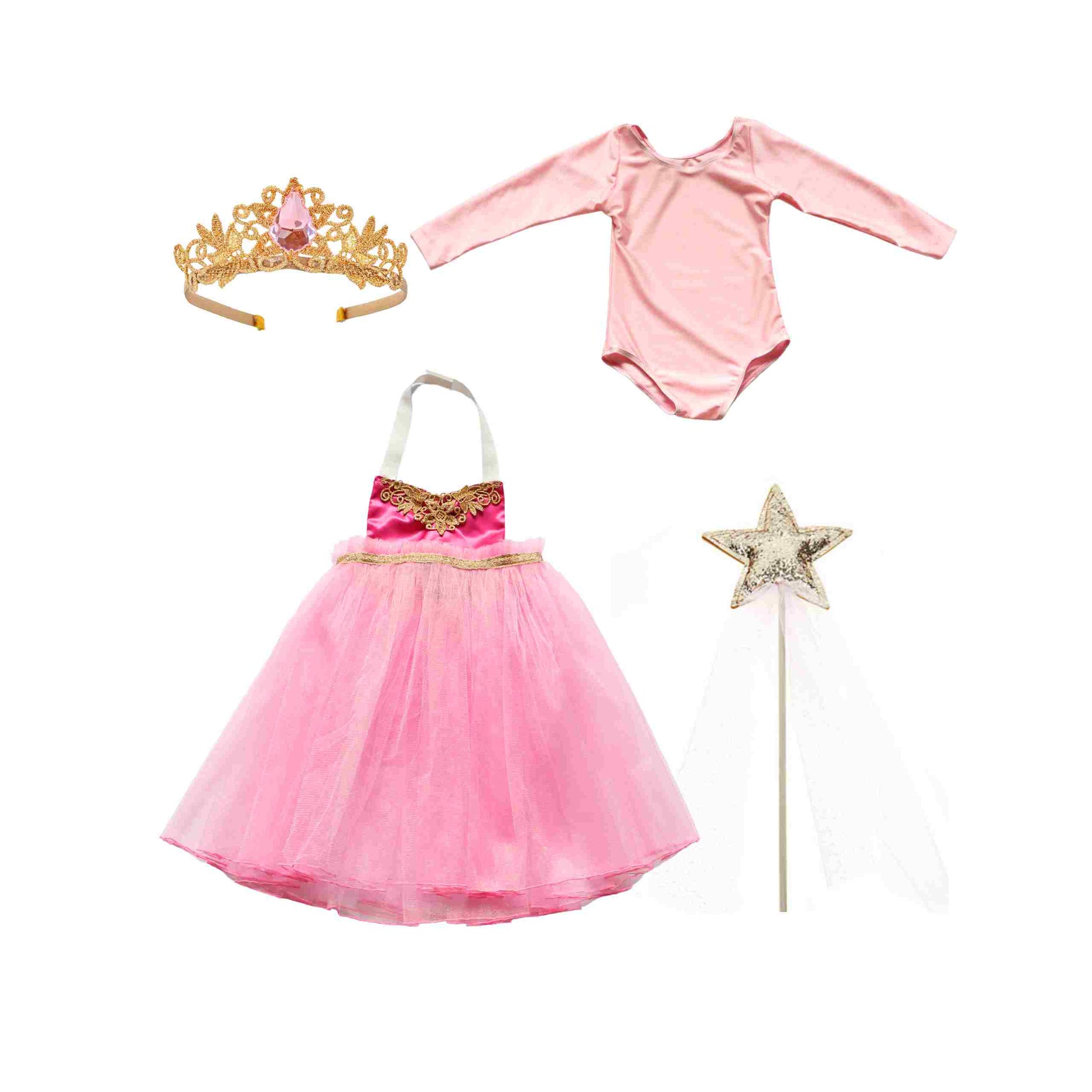 a little girl's pink dress, tiara, and wand