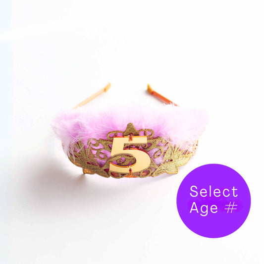 a pink and gold crown with the number five on it