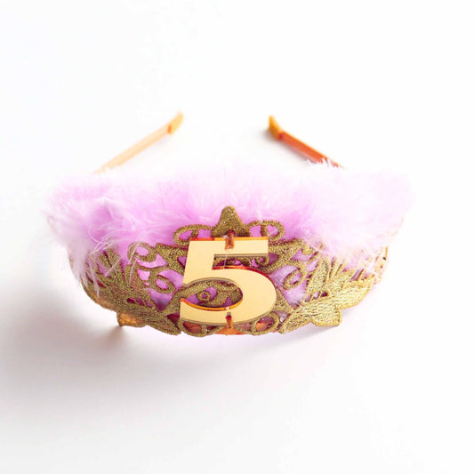 a pink headband with a number five on it