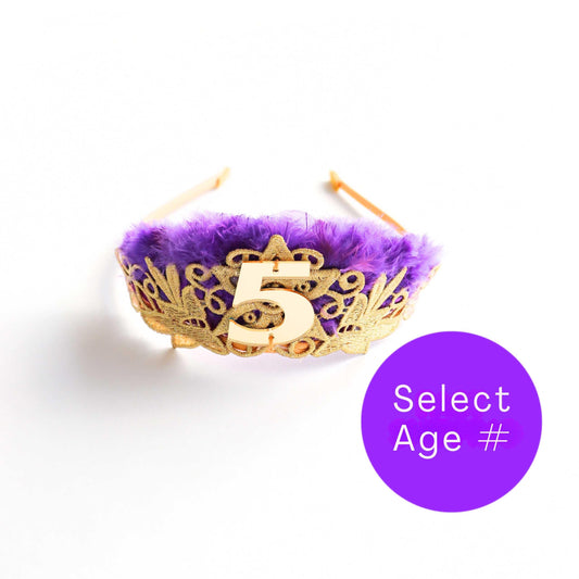 a purple and gold crown with the number five on it