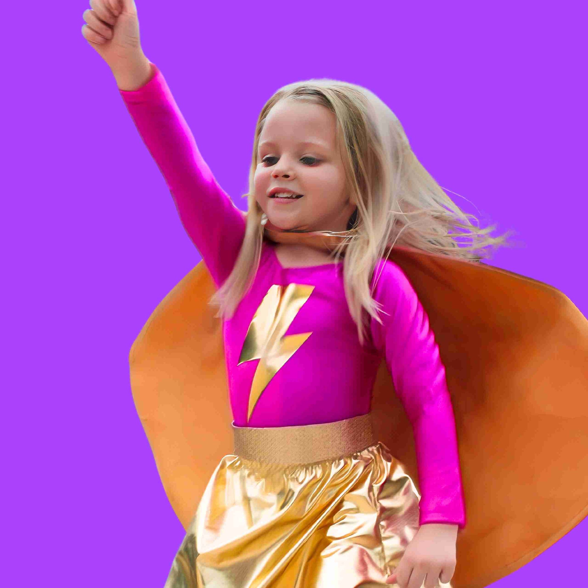 a little girl dressed as a super hero