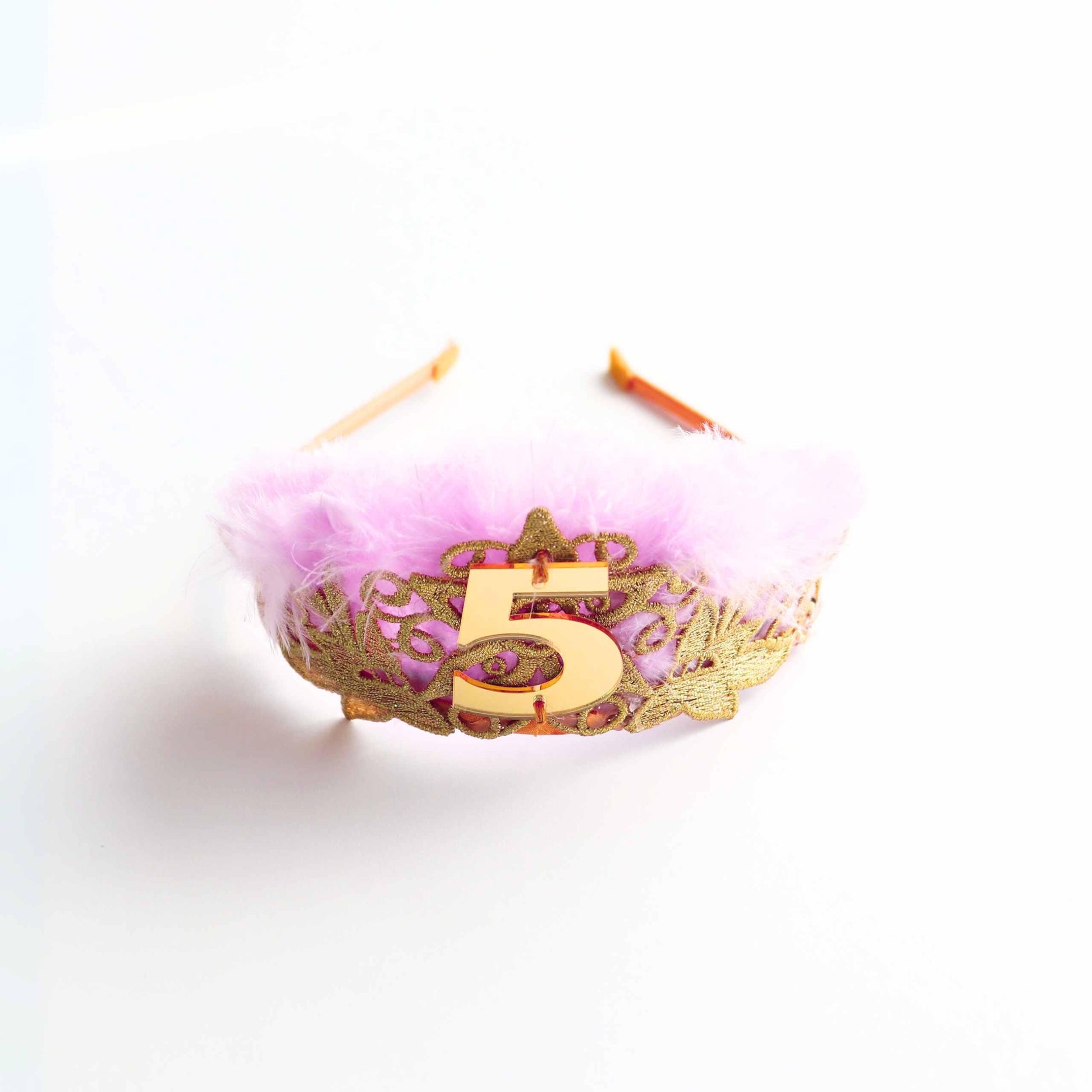 a pink and gold crown with the number five on it