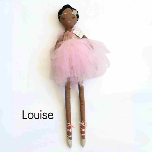 a doll with a pink dress and ballet shoes