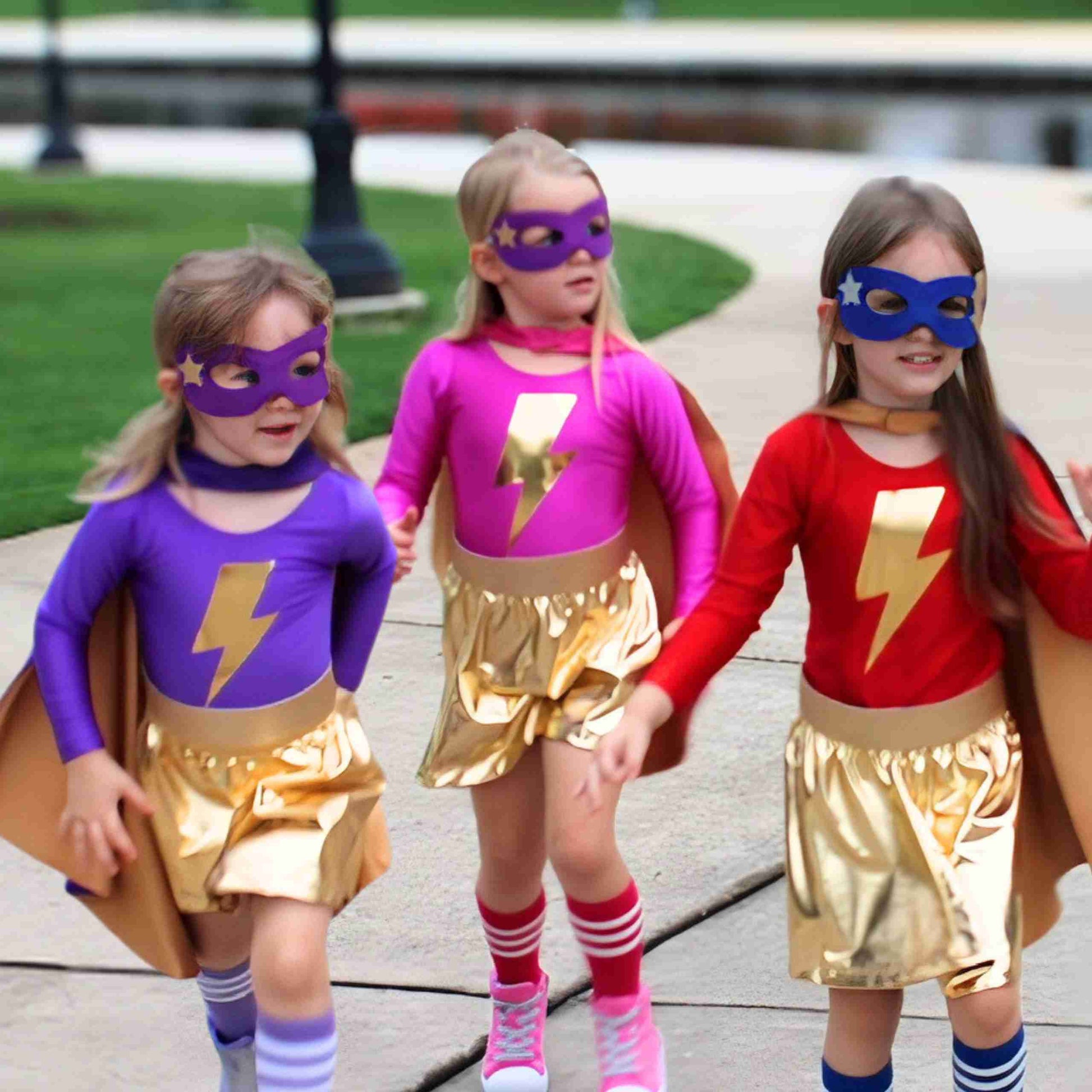 three little girls dressed up as superheros