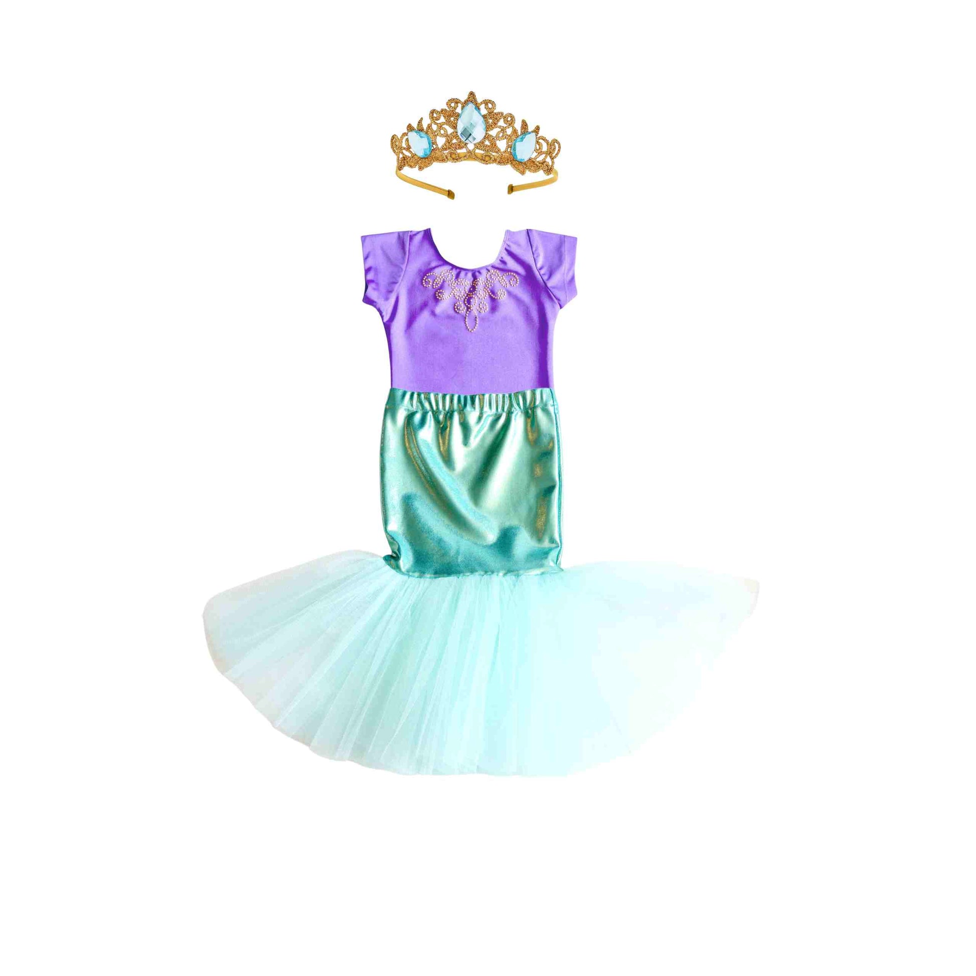 a little girl wearing a dress and a tiara