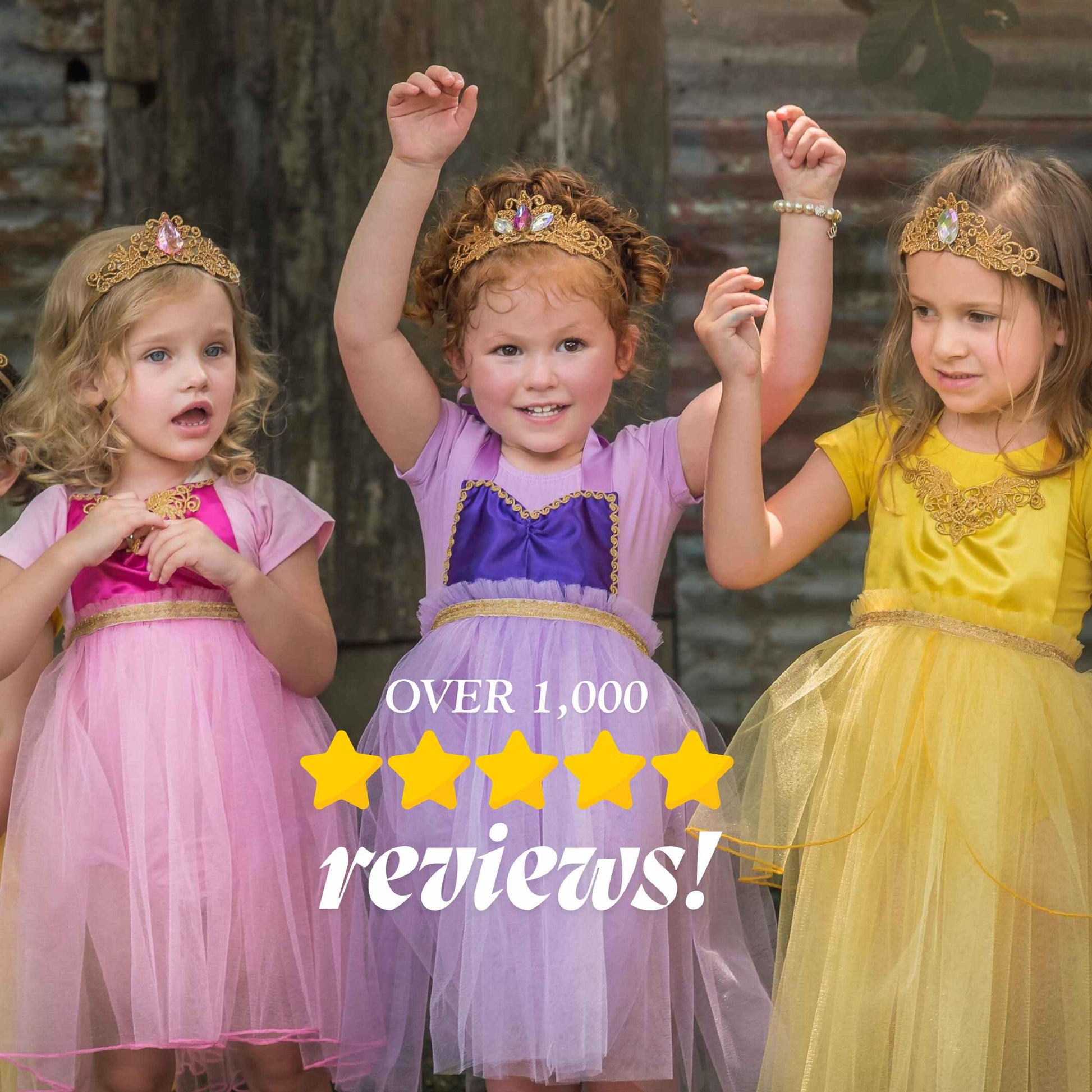 three little girls dressed in princess dresses and tiaras