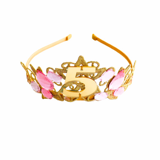 a gold tiara with pink flowers and the number five