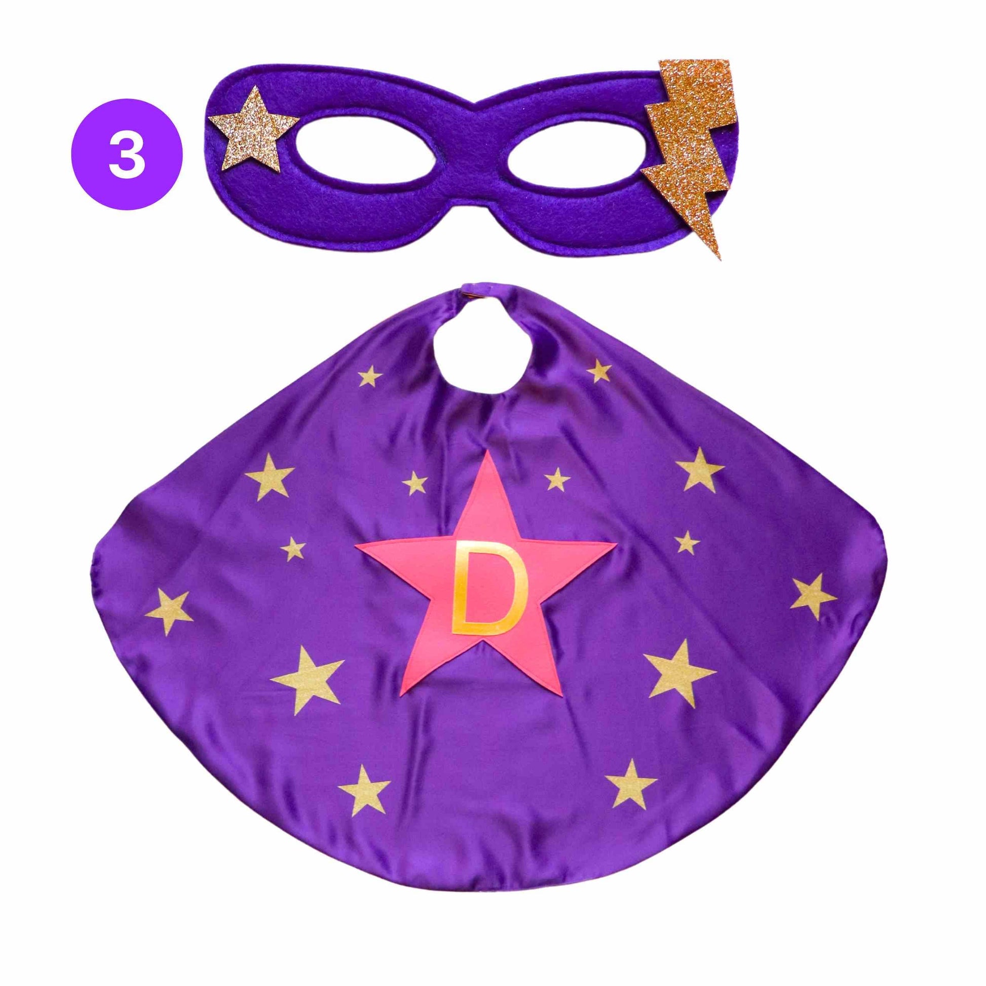 a purple cape with gold stars and a purple mask