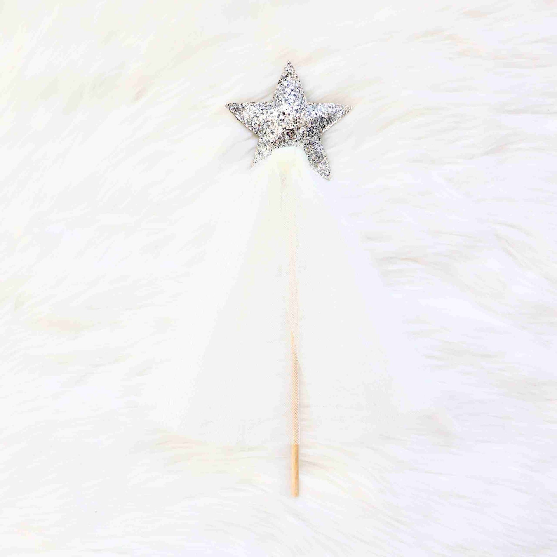 a star shaped object on top of a white fur