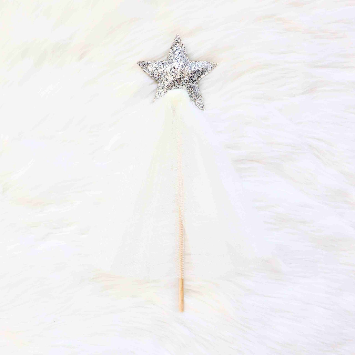 a white fur with a star on top of it